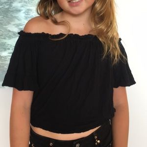 Black Emma and Sam of the shoulder shirt